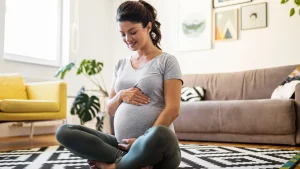 A pregnant woman practicing Garbh Sanskar for healthy pregnancy.