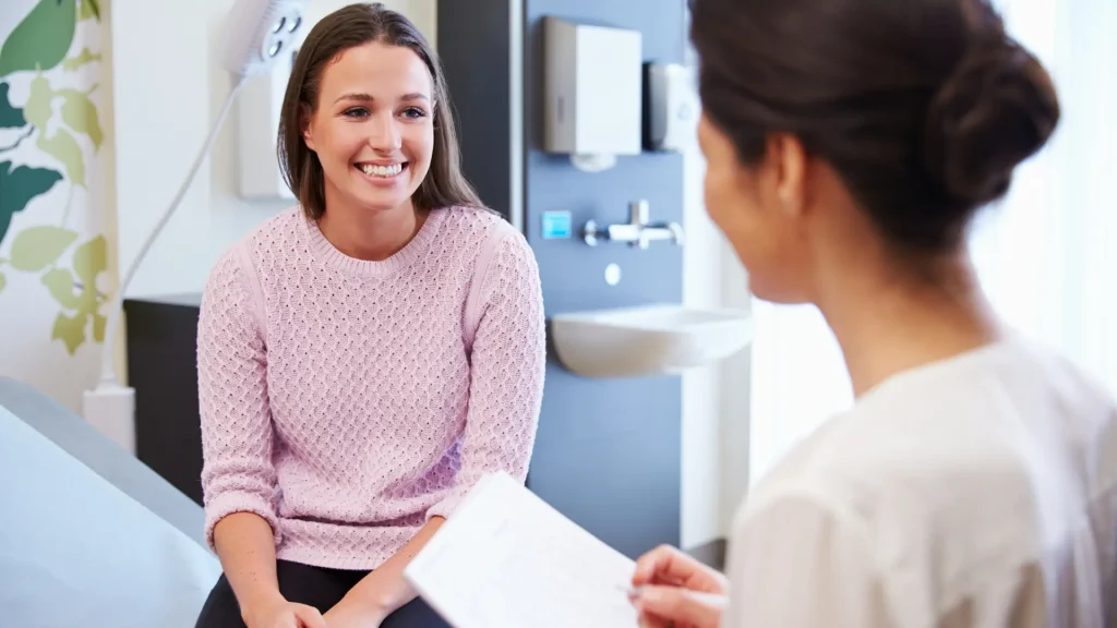 Doctor consults a young patient about her health.