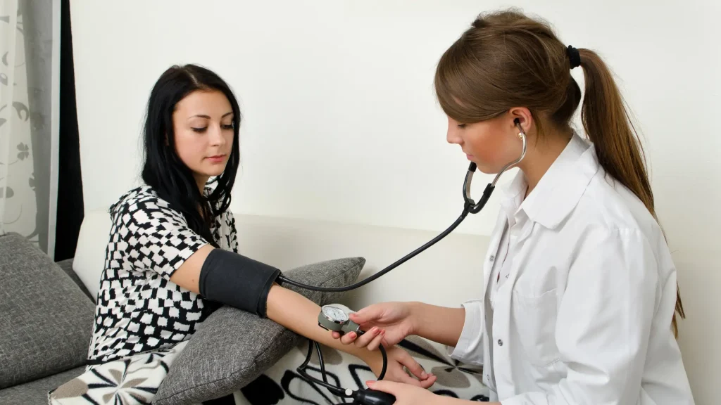 Lady doctor consults a patient about her health.