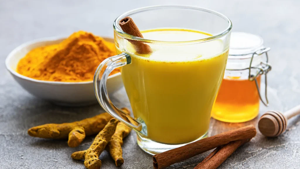 child-drinking-warm turmeric milk as a natural remedies for cough.