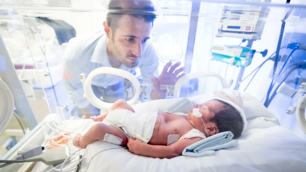 A parent bonds with their premature baby in the best NICU Hospital.