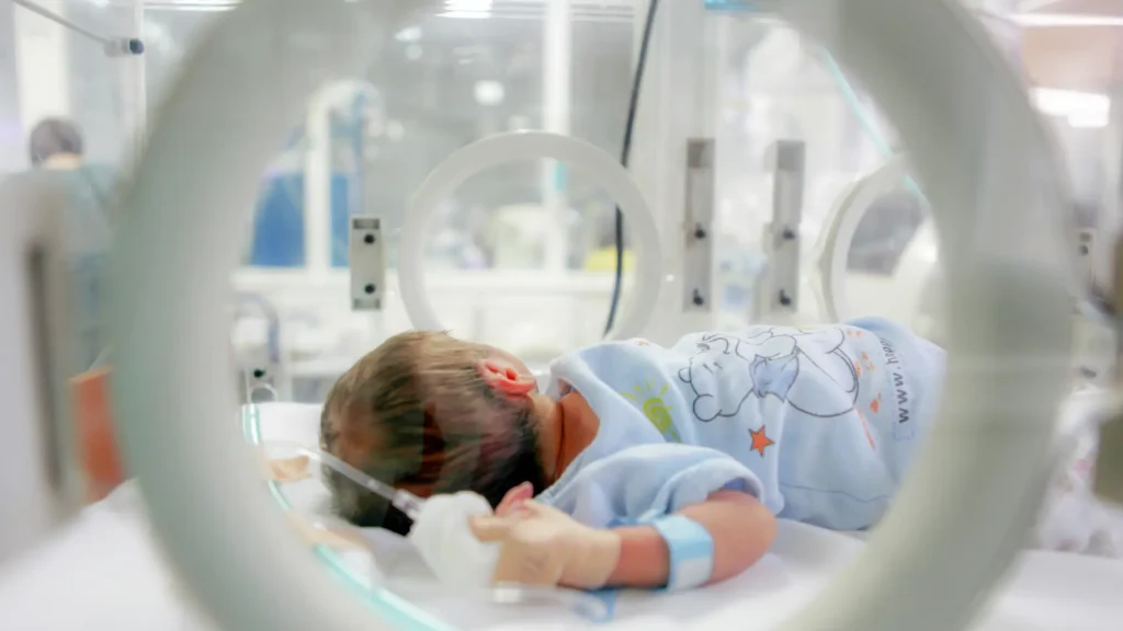 A parent with their premature baby in the best NICU hospital.