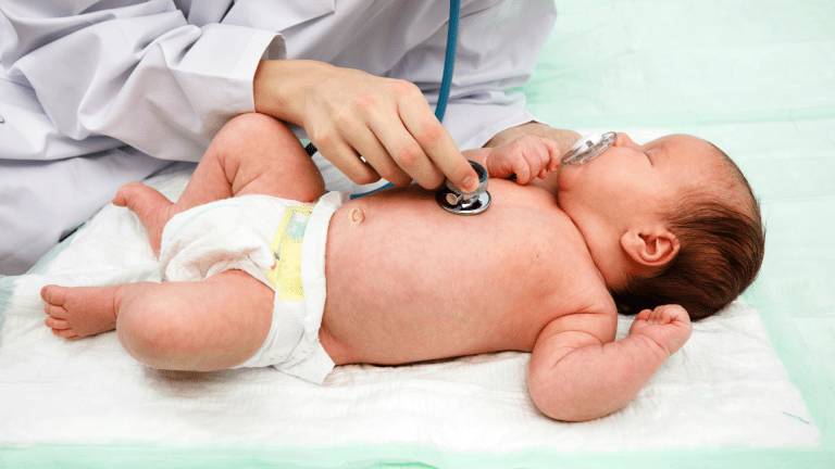 A neonatologist at Borneo Hospitals carefully checks a newborn baby not feeding problems.